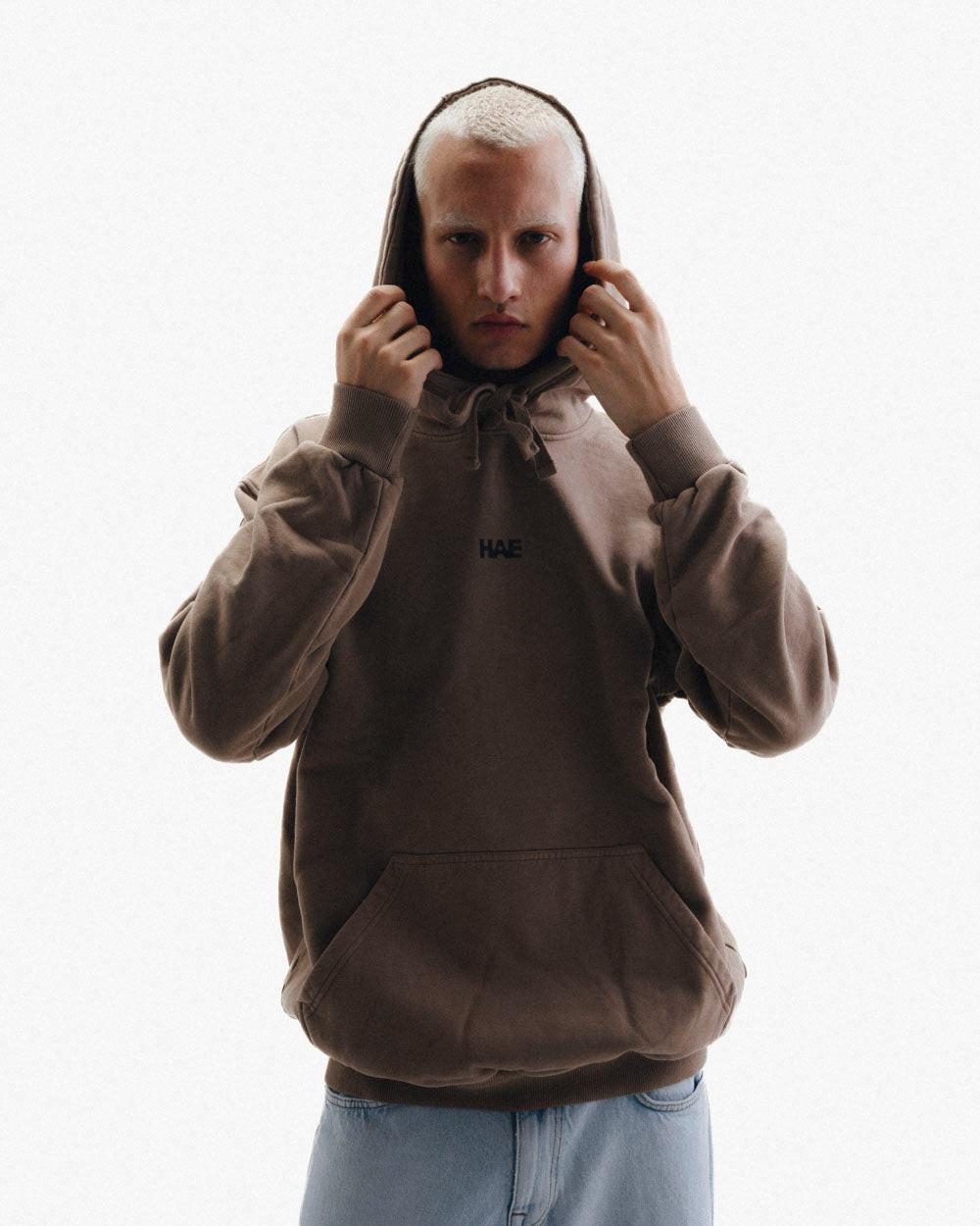 HAE Essentials Hoodie "Raised by the Alps".