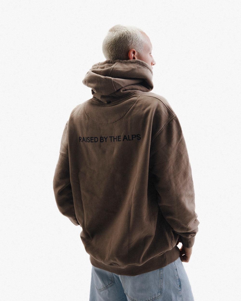 HAE Essentials Hoodie "Raised by the Alps".