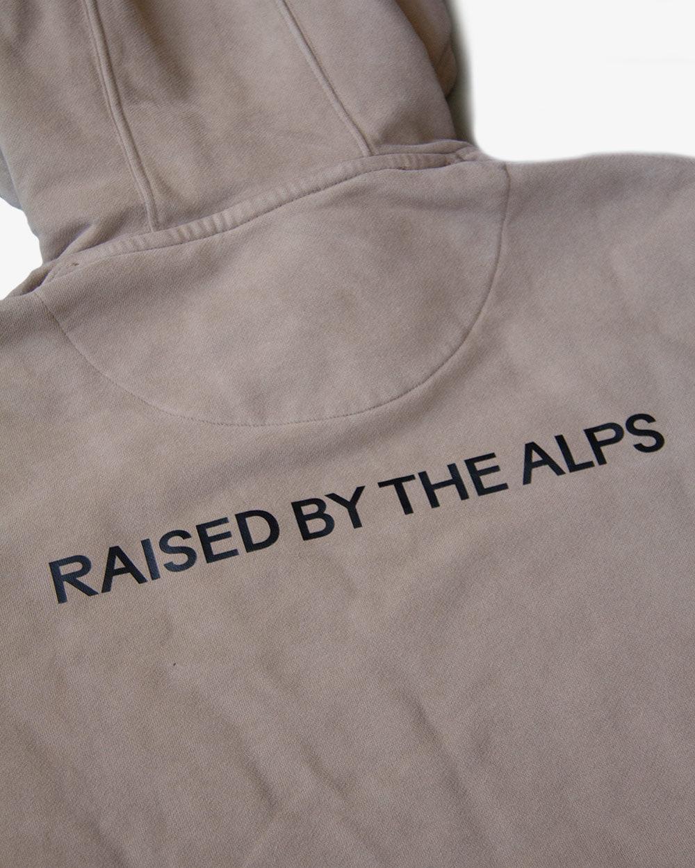 HAE Essentials Hoodie "Raised by the Alps".